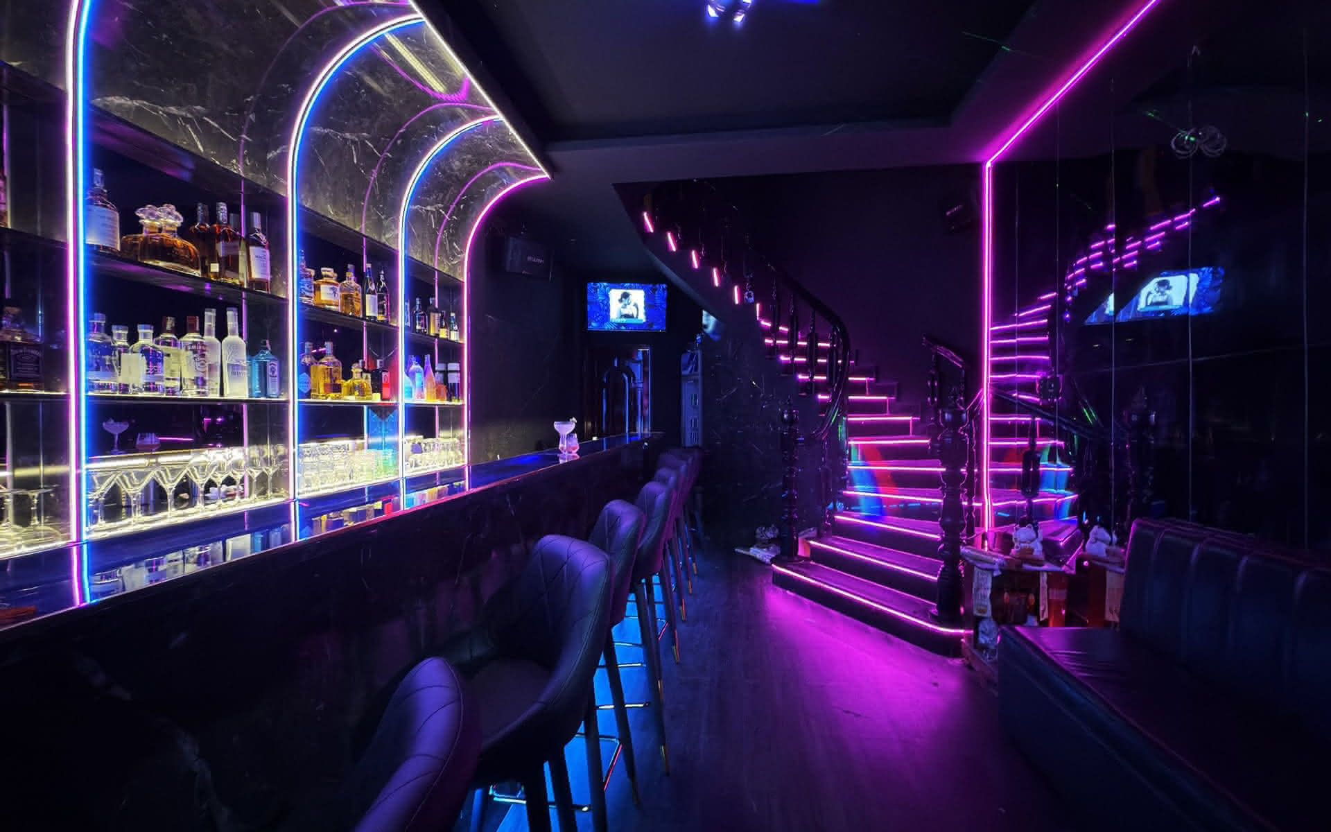 Enlarged detail of the backlit bottle shelves at Barbie Bar.